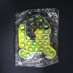 Lifestyle image of silicone pop it toy being used for relaxation and play