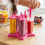 Hand holding frozen popsicle made using BPA-free plastic ice cream mold