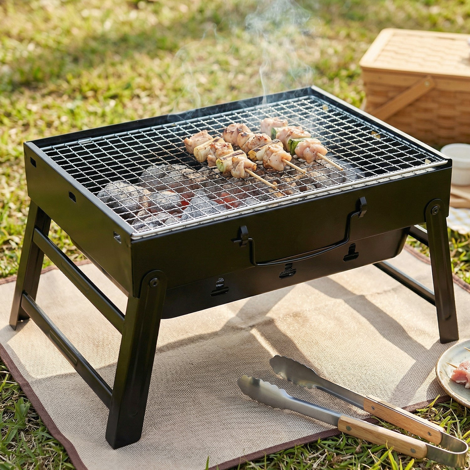Outdoor camping BBQ grill with spacious grilling surface