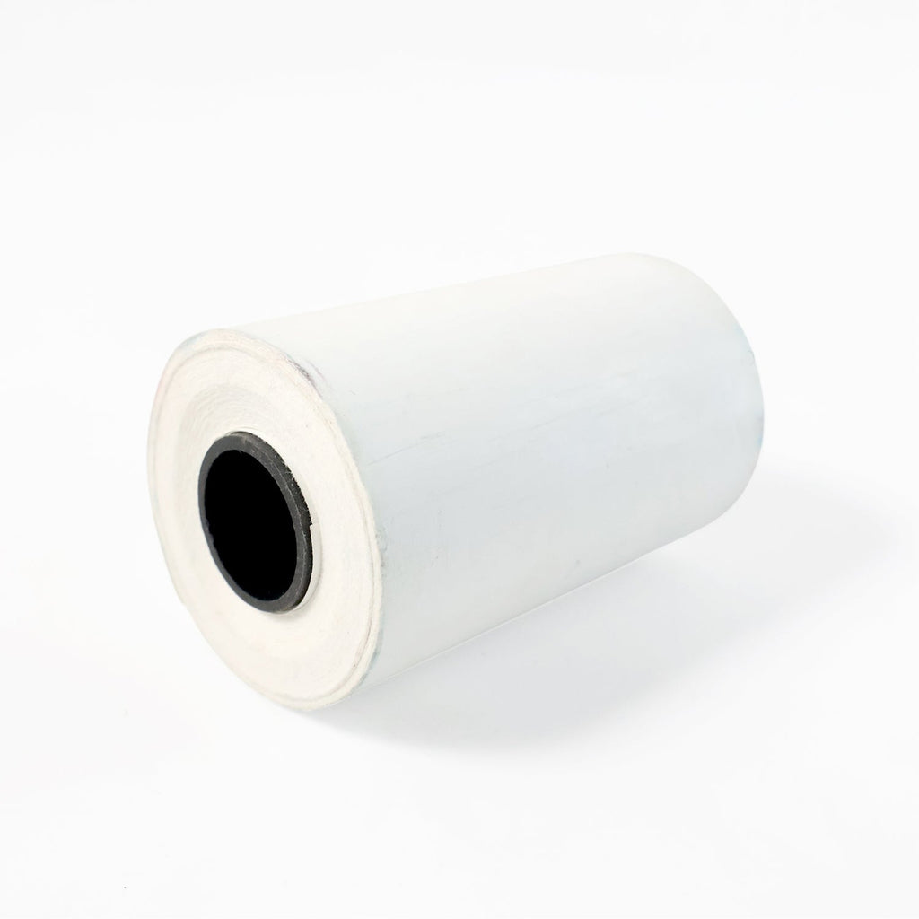 Close-up view of thermal label roll showing label texture
