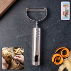 Vegetable peeler with peeled carrot and potato for demonstration