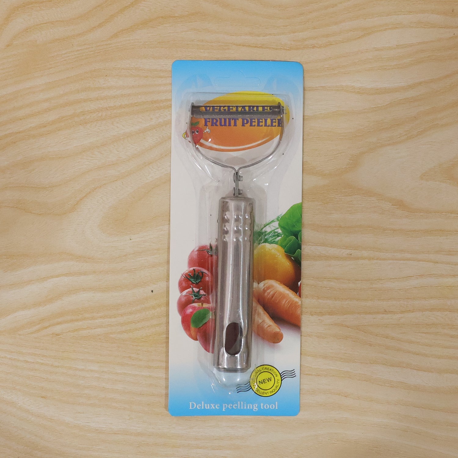 Compact stainless steel vegetable peeler on countertop