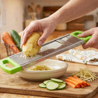 The potato slicer shown with potatoes, illustrating its primary use as a vegetable cutter.
