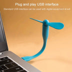 Compact portable USB fan in use for personal cooling