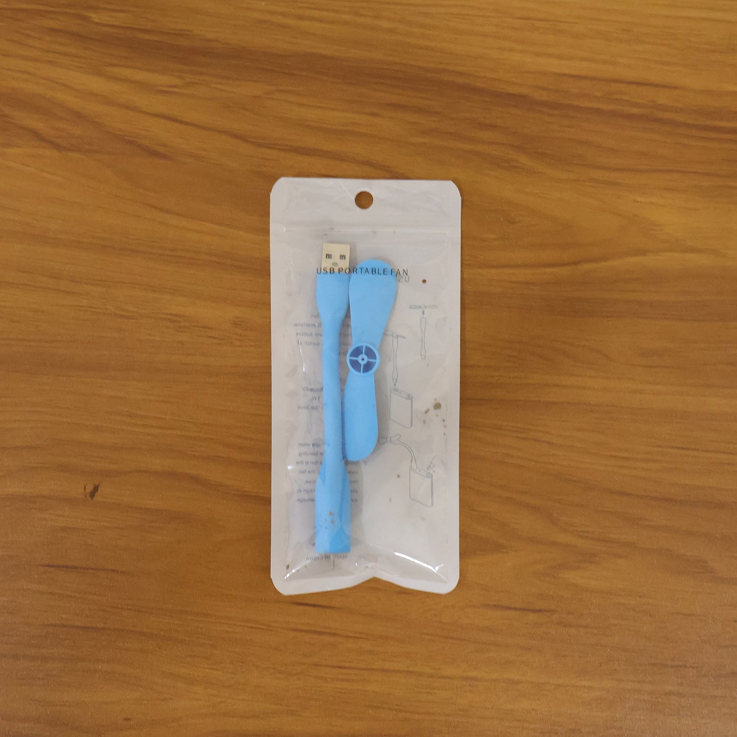 Portable USB mini fan in use for cooling on-the-go