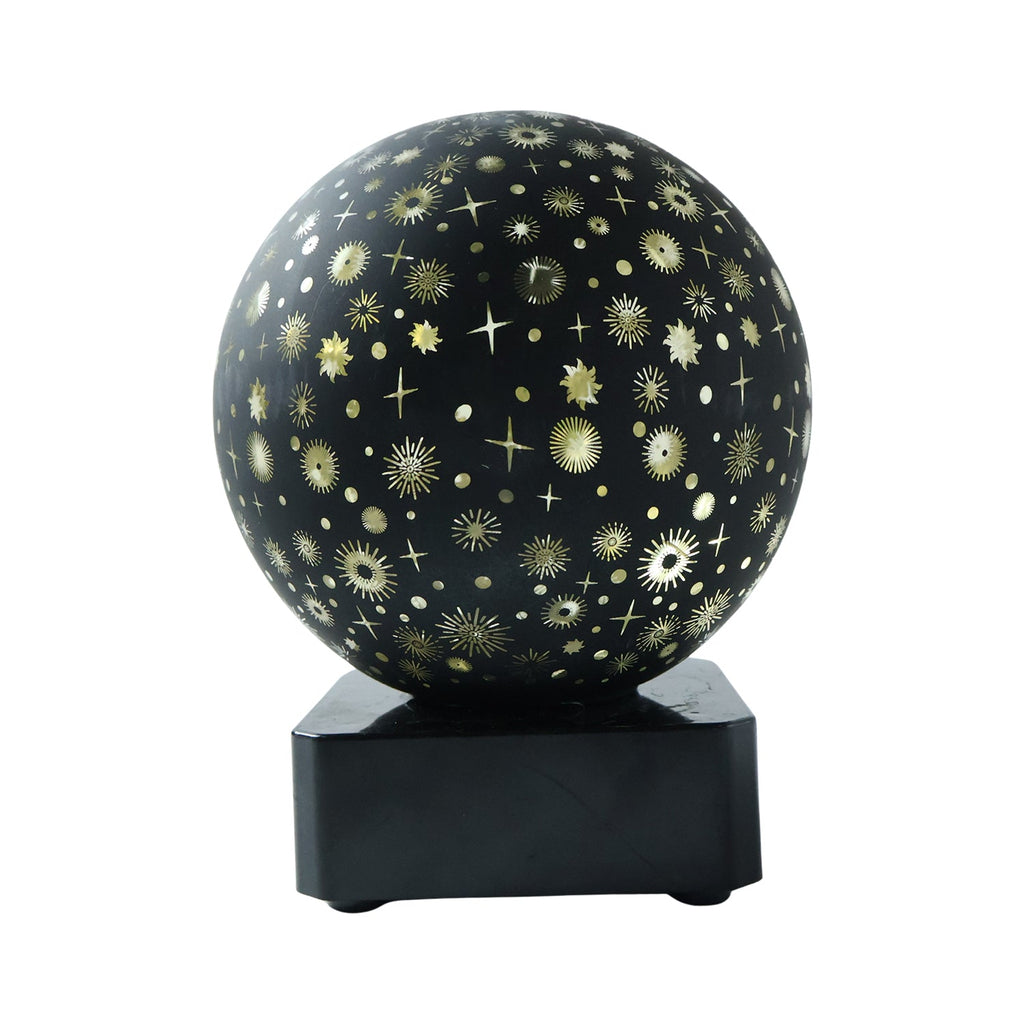 Galaxy themed projector night light casting warm ambient light