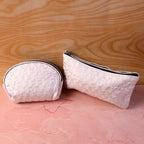 Compact cosmetic bags included in the 3-in-1 makeup organizer set