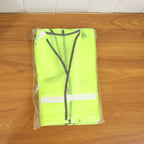 Individual wearing the reflective safety jacket during an outdoor activity for visibility.