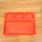 Serving tray in use holding various food items separately