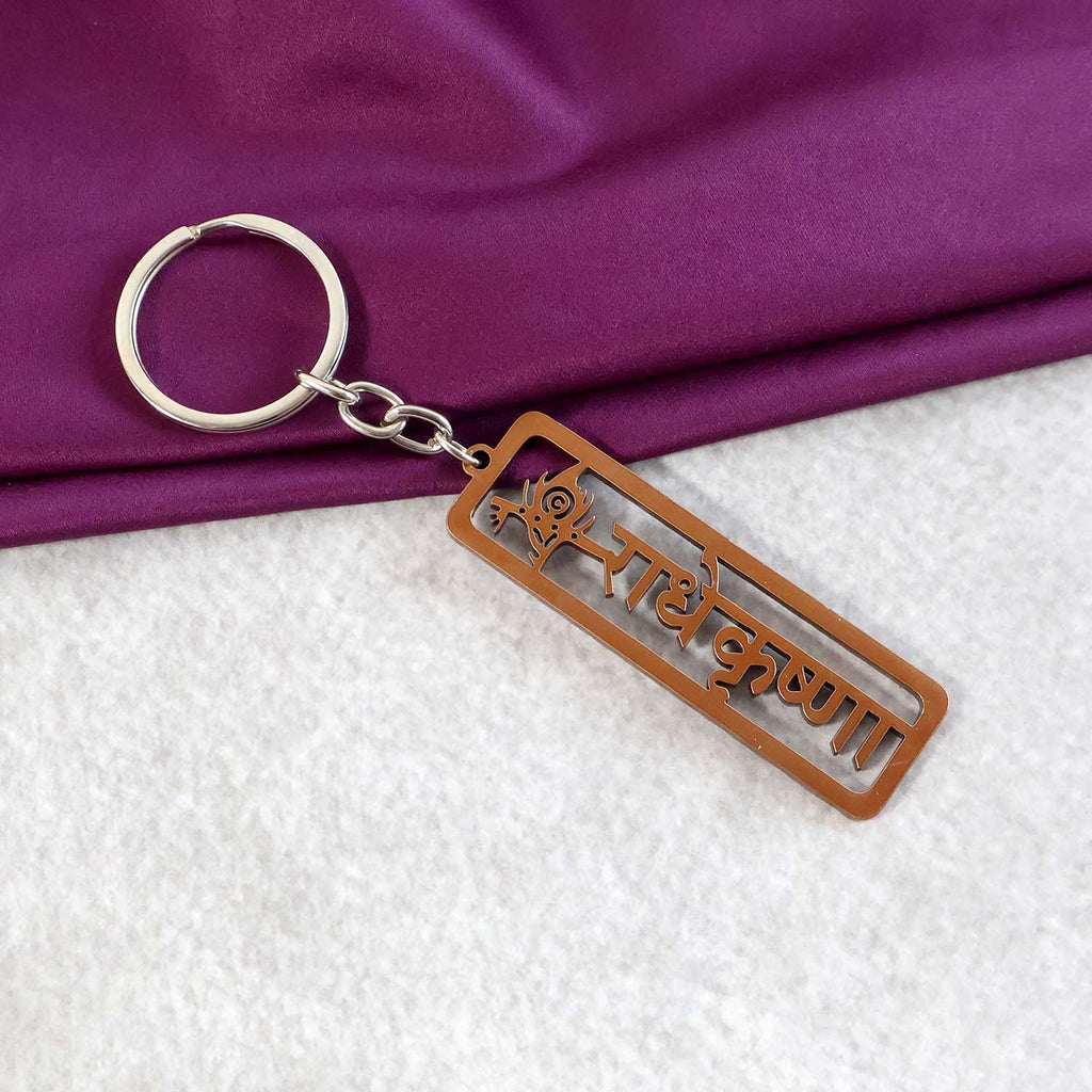 Radha Krishna keychain with Krishna motif and peacock feather design