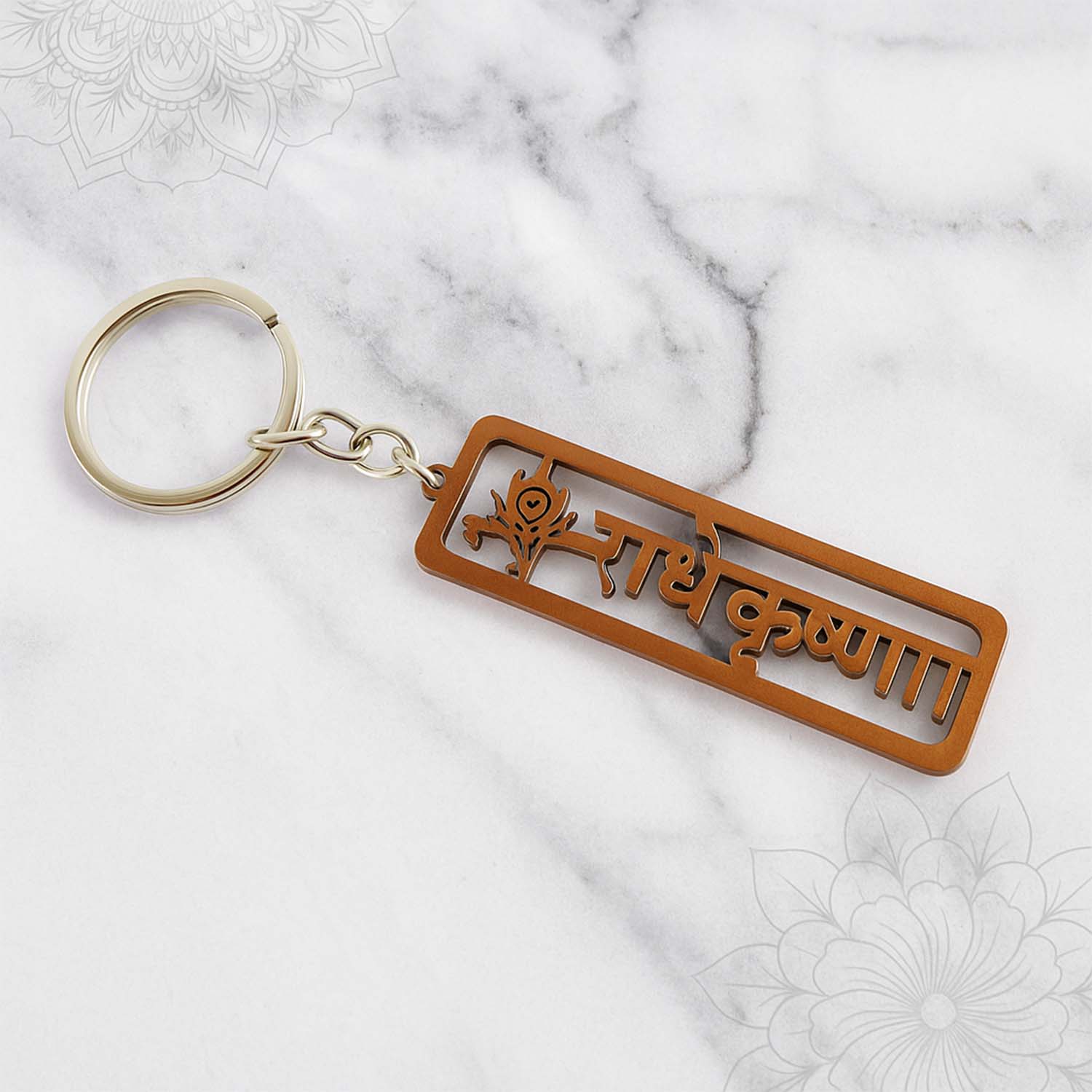 Brass-like Radha Krishna religious metal keychain showing intricate design