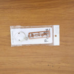 Lifestyle image of Radha Krishna metal keychain on a keyset