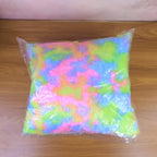 Comfortable plush throw pillow with rainbow design in living room