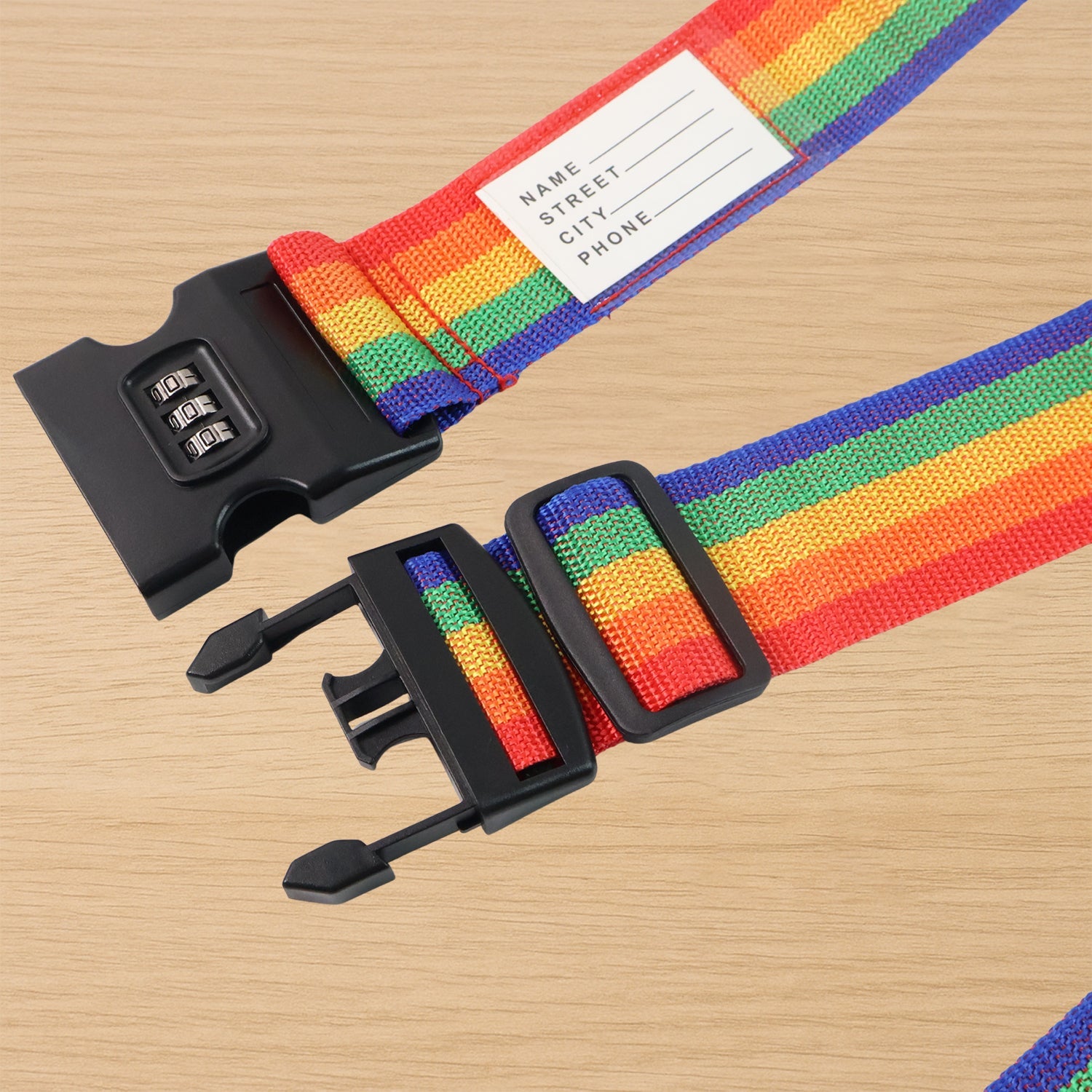 Detail of the durable buckle and webbing on the Rainbow Luggage Strap.