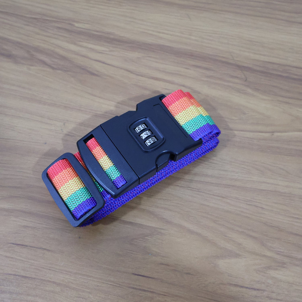 Rainbow Luggage Strap securing a black suitcase, making it easy to spot.