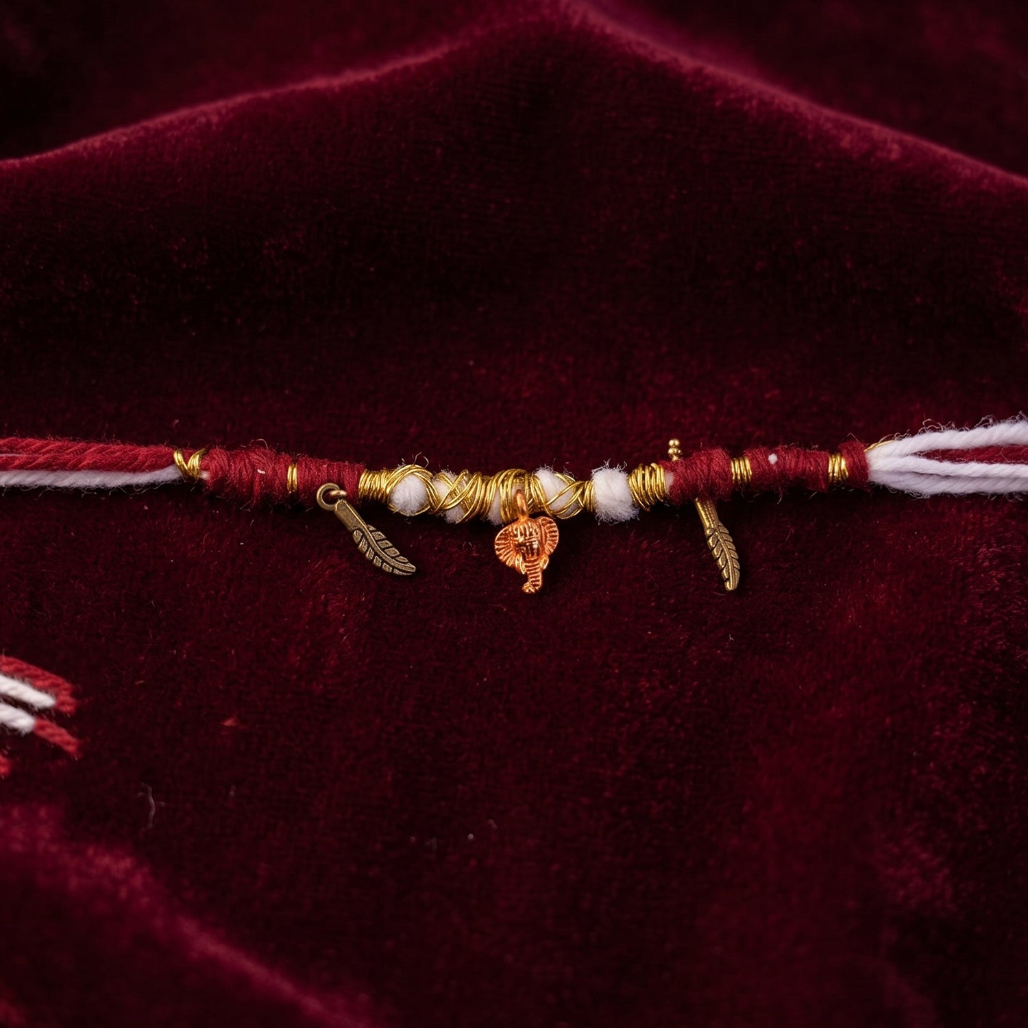 Traditional Ganesh rakhi with gold wire work