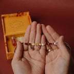 Handmade pearl beaded rakhi with Ganesh charm