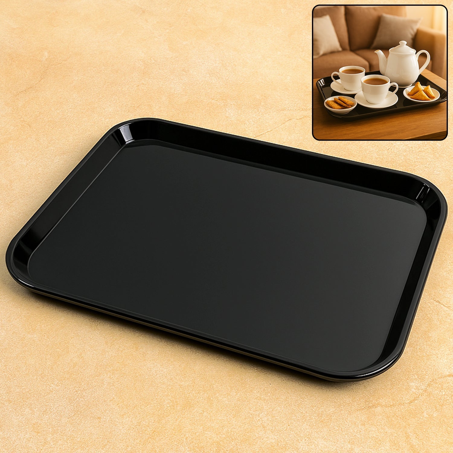 Black plastic serving tray with rectangular shape placed on a plain background