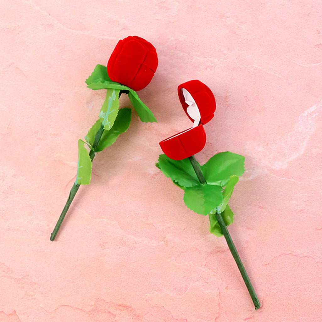 Side view of two-piece artificial rose ring box set with realistic flower design for ring presentation