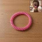 Telephone wire hair band showing spiral design for secure hair styling