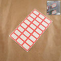 Sheet of red and white self-adhesive rectangular label stickers arranged neatly