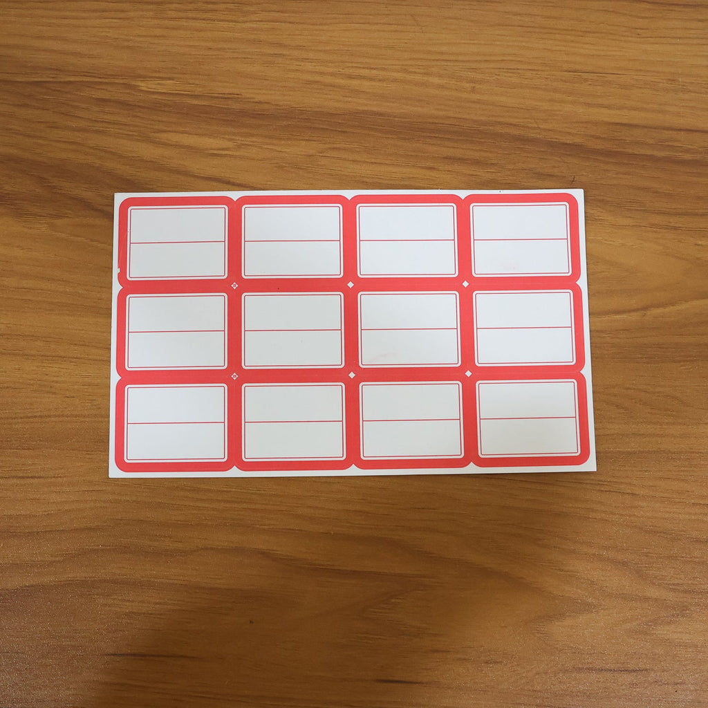 Red and white self-adhesive stickers applied on jars for labelling
