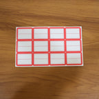 Red and white self-adhesive stickers applied on jars for labelling