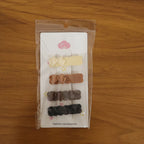 Model styling hair with elegant bow hair clip from 4-piece set