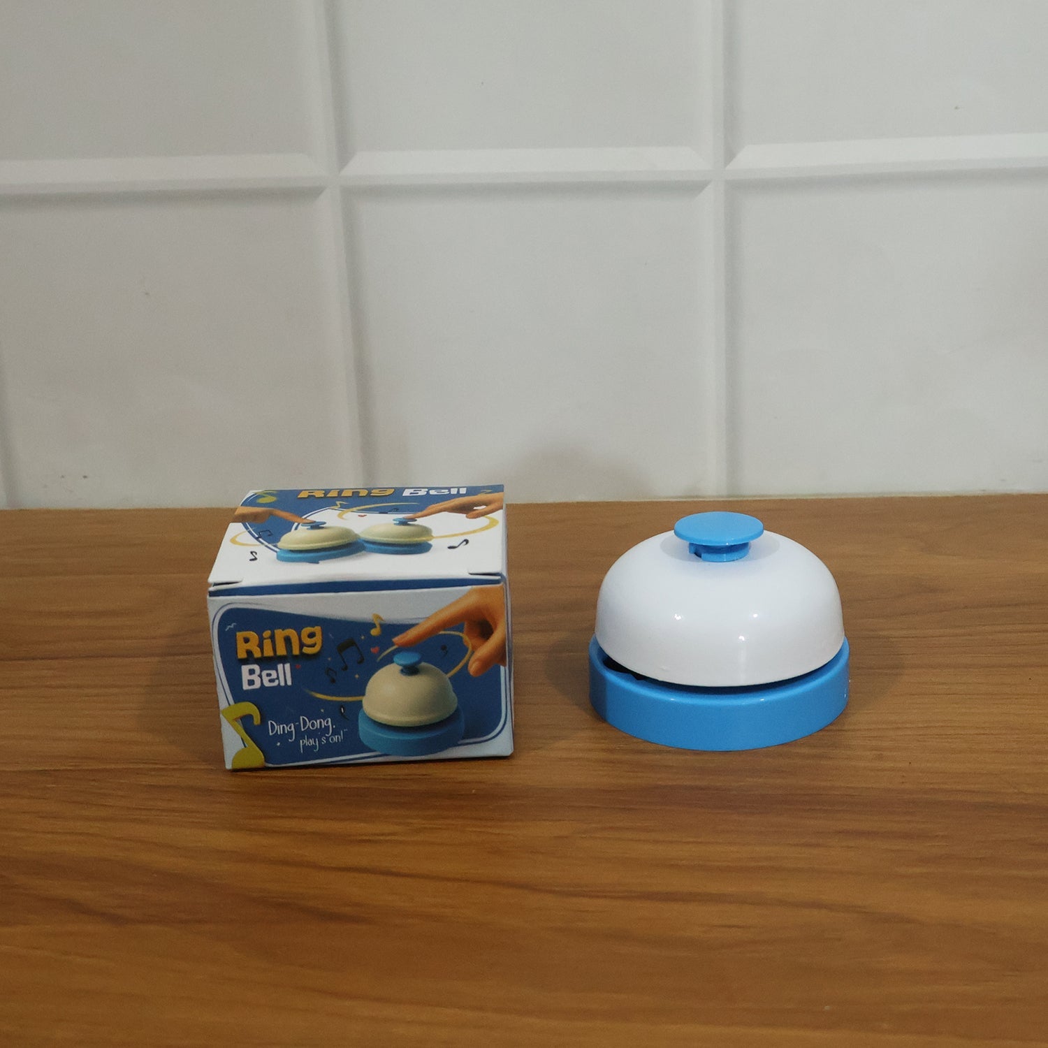 Desk ring bell in live use on office reception desk