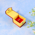 Ring holder featuring a decorative diamond pattern and protective hard casing
