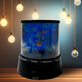 LED Projector Night Light illuminating a dark room with vibrant star and moon patterns.