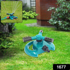 Connecting a garden hose to the 3-arm water sprinkler for easy setup.