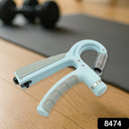 Close-up of the portable hand grip strength trainer for daily use.