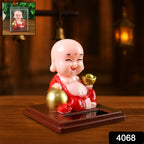 Close-up of the Solar Buddha Car Ornament, highlighting the solar panel for automatic movement.