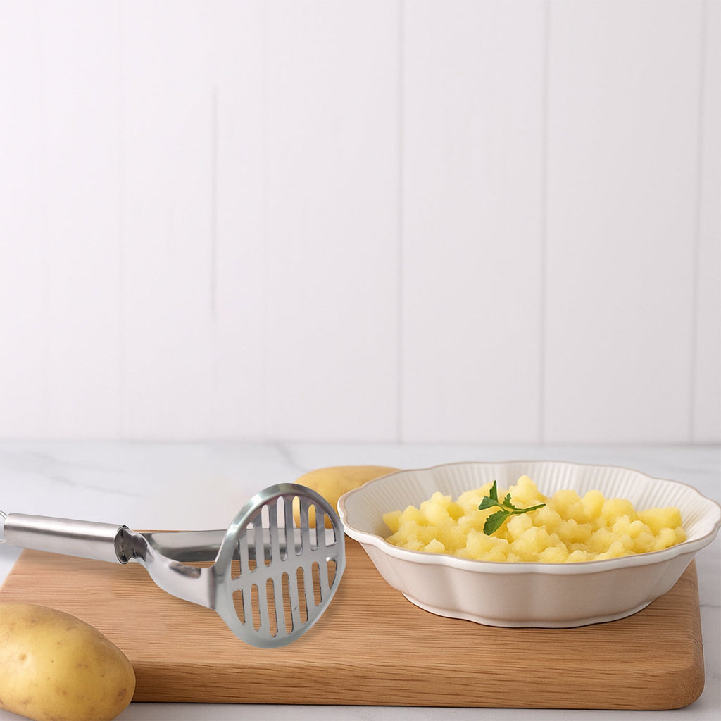 Close-up of stainless steel potato masher with sturdy design