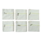 Six saree storage zipper pouches arranged for wardrobe organization