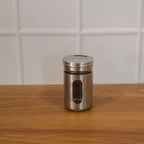 Lifestyle image of stainless steel spice jar in kitchen setting