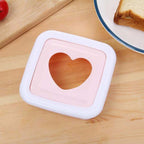 Angled view of heart sandwich cutter bread press tool