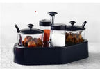 Full view of Ganesh Spice Condiment Set with transparent jar and colourful lid.