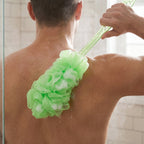 Soft mesh loofah on an extended handle, perfect for gentle body exfoliation.