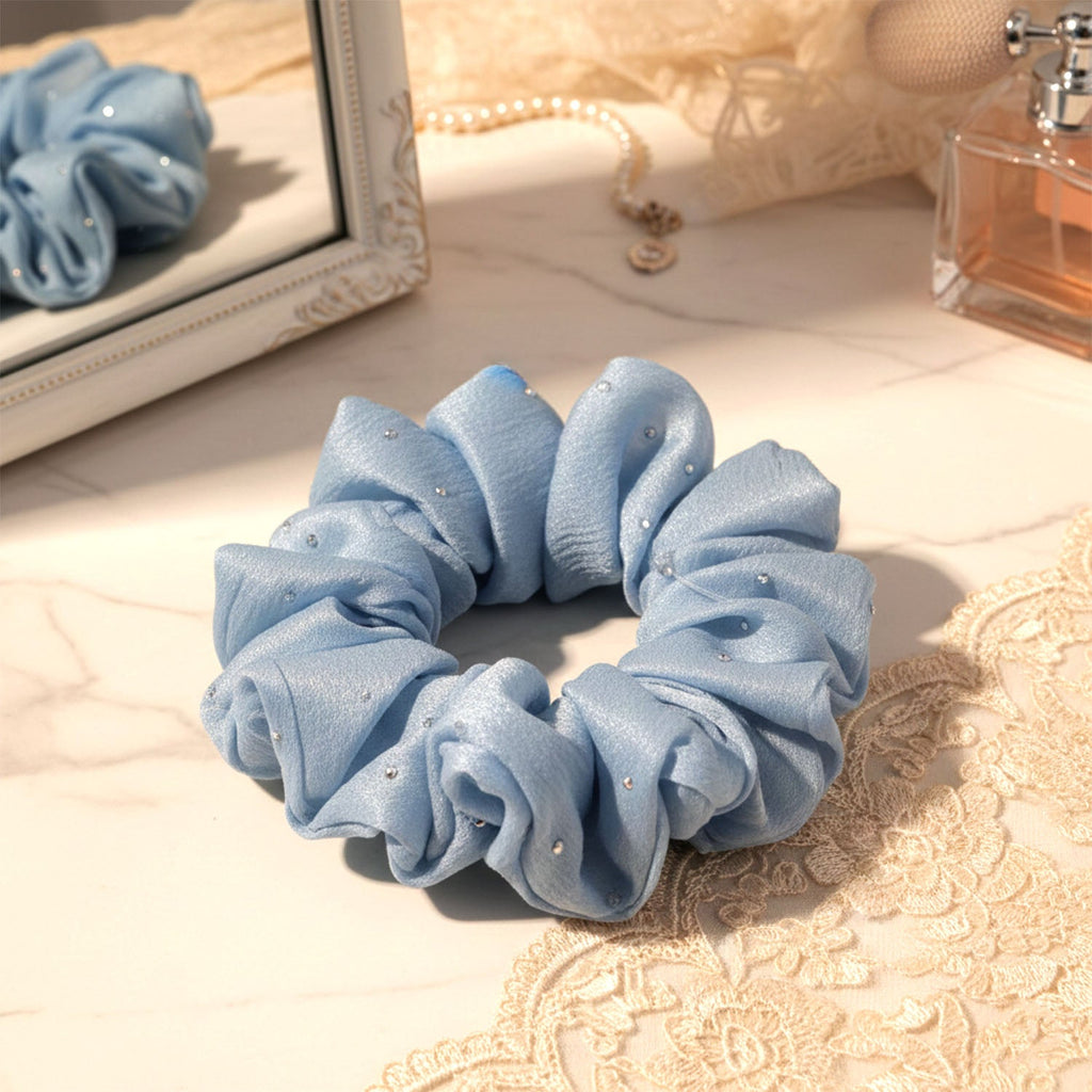 Fabric hair scrunchie showing soft material and elastic band