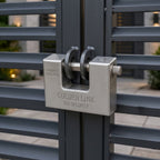 94mm security padlock securely fastened on a wooden gate latch.