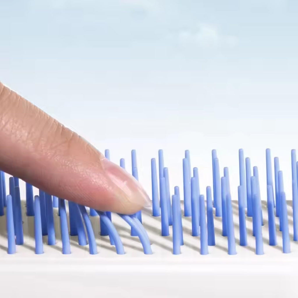 Close-up view of the Self-Cleaning Hairbrush's innovative massage bristles