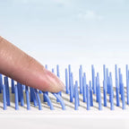 Close-up view of the Self-Cleaning Hairbrush's innovative massage bristles
