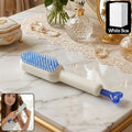 Self-Cleaning Hairbrush with retractable bristles on a white background
