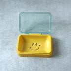 Lightweight plastic soap dish with smiley design