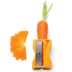 Handheld vegetable peeler tool at an angle in kitchen