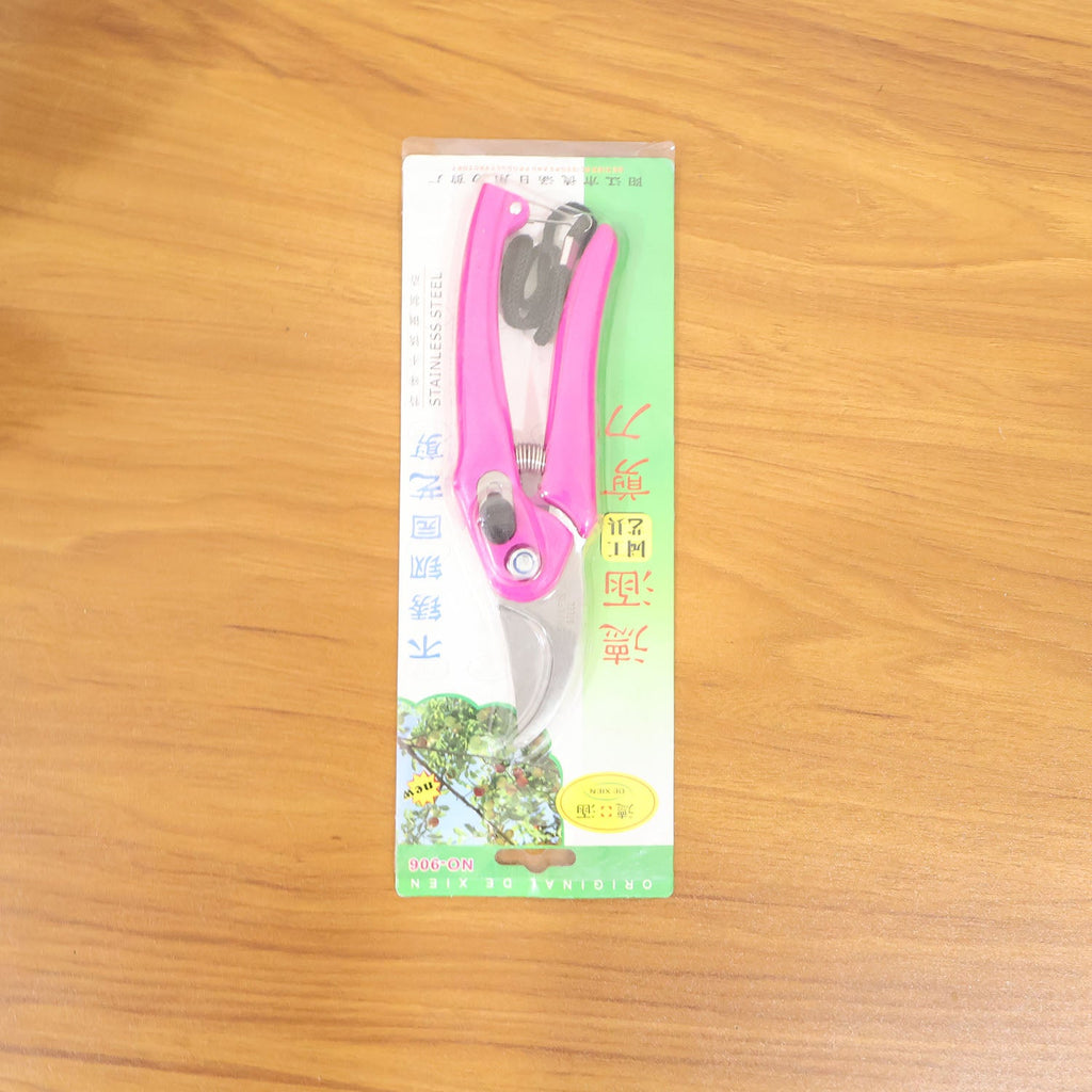 Gardener using the flower cutter to prune live plants with precision.