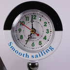 Ship shape clock lamp lit on table showing warm LED ambiance