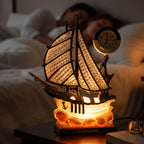 Close-up of clear analog dial on ship shape clock lamp